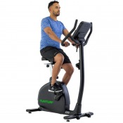 Person som tränar på Tunturi E80 Endurance motionscykel i upprätt position med händerna på styret