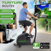 Tunturi E80 Endurance motionscykel placerad i ljus träningsmiljö med grön bakgrund