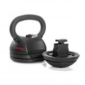 Detaljbild på kettlebell med avtagna viktplattor placerade bredvid på vit bakgrund.