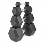 Staplad grupp av svarta hexhantlar med sexkantiga ändar, fotograferade nära mot vit bakgrund.