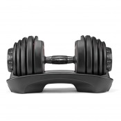 Bowflex SelectTech 552i justerbar hantel liggande med räfflat grepp och svarta viktsegment på sidorna.