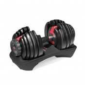 Bowflex SelectTech 552i justerbar hantel med viktsegment och röd mittmarkering, placerad på plan yta.