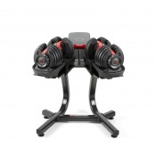 Bowflex SelectTech 552i justerbar hantel placerad i hantelställ med böjd svart ram.