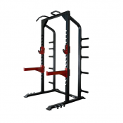 Impulse SI7014 Half Power Rack i svart stål med röda säkerhetsarmar och vikthorn, sedd i sned vinkel.