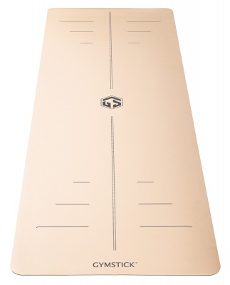 Yogamatta i sandfärgat utförande med centrerad logotyp och markerade linjer sedd ovanifrån.